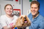 Dr Chris Brown visits young patients at Perth Children’s Hospital with support dog Murphy